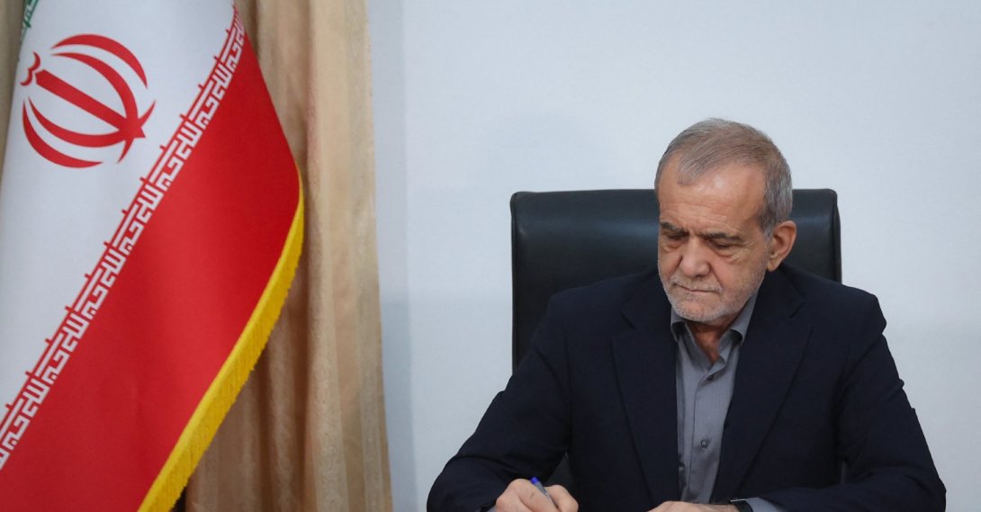 This handout picture released by the Iranian Presidency shows Iran's President Masoud Pezeshkian signing a memorandum of understanding in Tehran, June 18, 2026. (AFP File Photo)