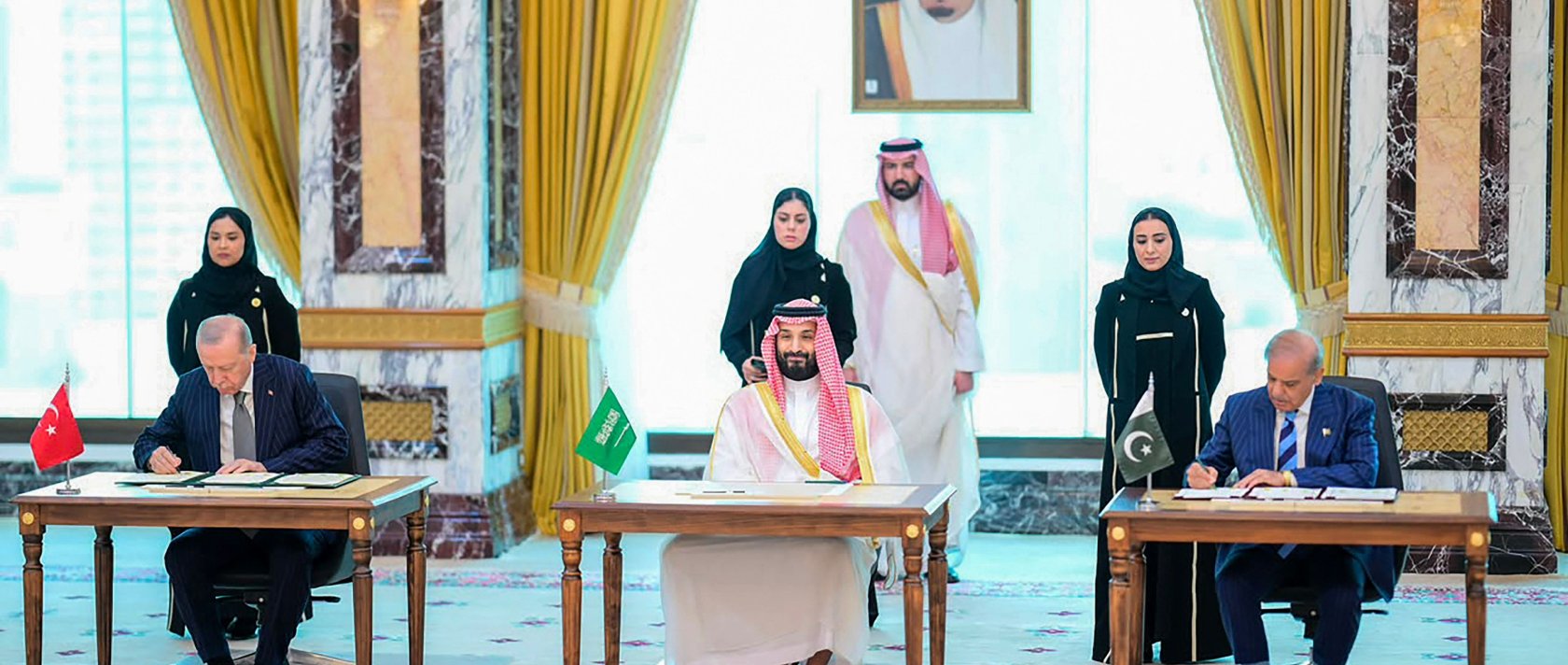 President Recep Tayyip Erdoğan, Saudi Crown Prince Mohammed bin Salman and Pakistani Prime Minister Shehbaz Sharif sign the Mecca Joint Defence Agreement in Mecca, Saudi Arabia, Aug. 7, 2026. (Pakistan Prime Minister's Office Handout via AFP) 