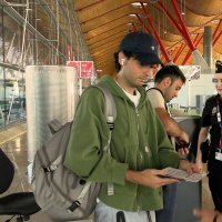 Spanish national police officers check the documents of travellers arriving from Italy, after Spain's government said it would establish border controls for flights and ships from Italy, at Madrid-Barajas Airport, Madrid, Spain, Aug. 8, 2026. (Reuters Photo)