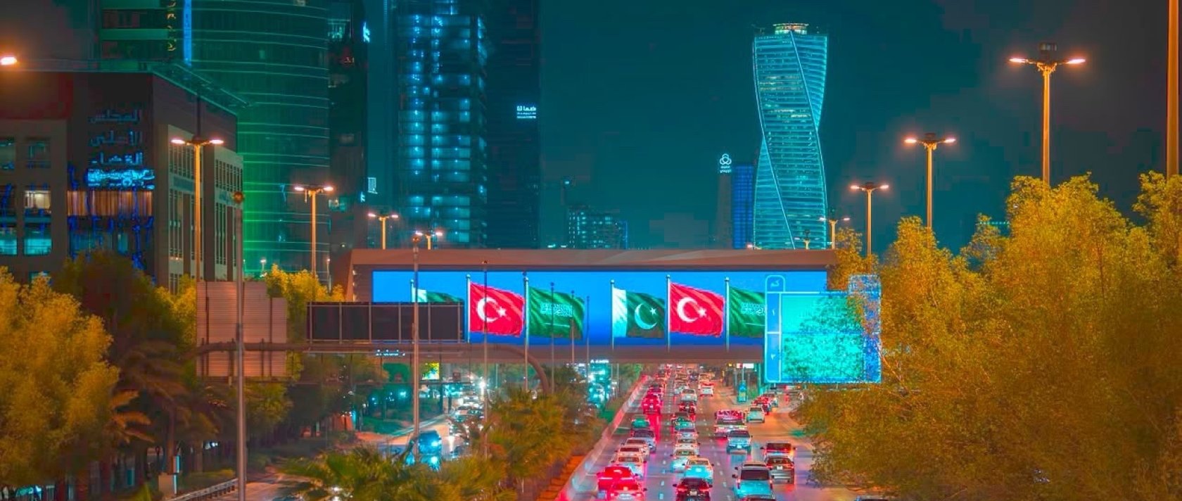 An overpass above the King Fahd Road displays the Pakistani, Turkish, and Saudi flags after the signing of a landmark defense agreement in Riyadh, Saudi Arabia, Aug. 7, 2026. (Courtesy of SPA)