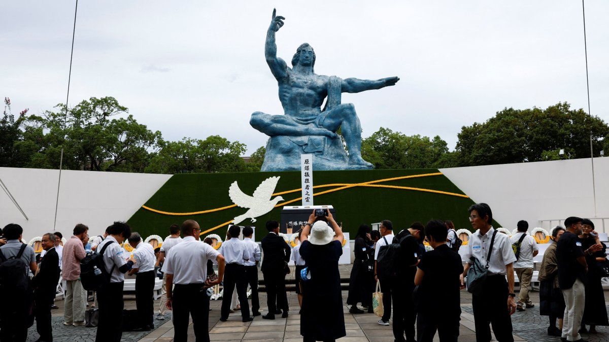 Attendees gather in front of the Nagasaki Peace Statue on the day of a ceremony commemorating the 81st anniversary of the bombing of Nagasaki, southwestern Japan, Aug. 9, 2026. (Reuters Photo)