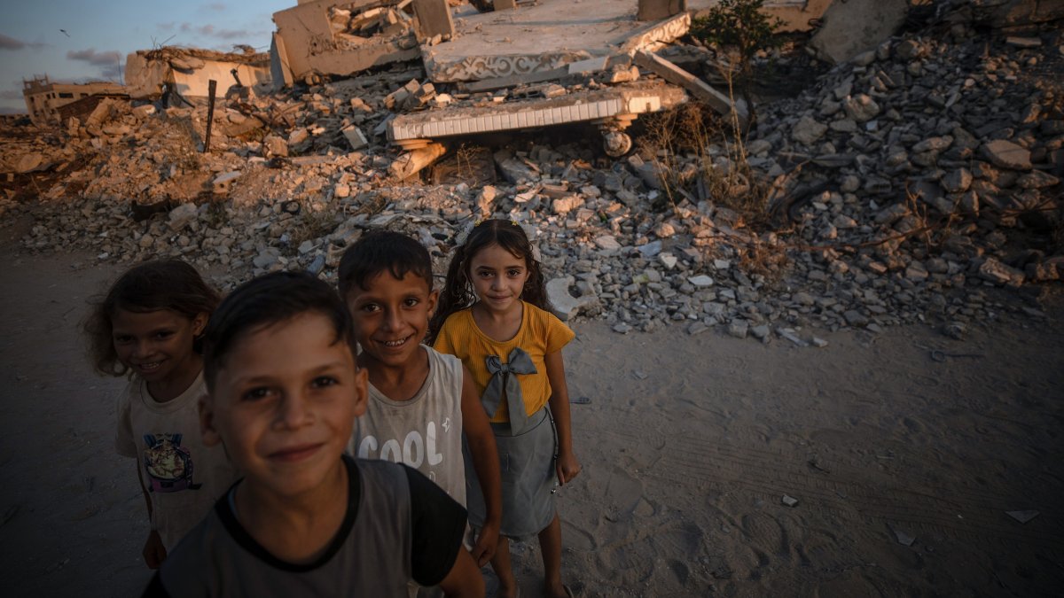 Displaced Palestinian children pose for a photograph among the rubble of destroyed buildings, in Jabalya, north of Gaza City, Palestine, Aug. 7, 2026. (EPA Photo)