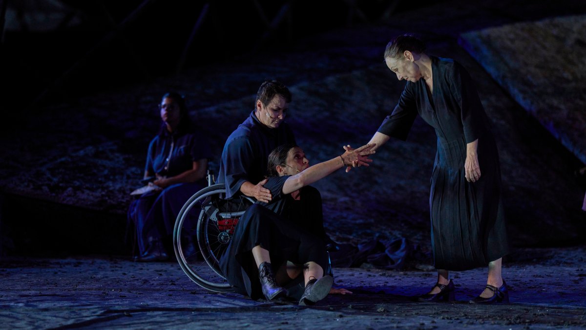 From L-R, Eirini Kourouvani, a wheelchair dancer, Evi Saoulidou and Lydia Fotopoulou perform during a dress rehearsal of Euripides' tragedy "The Trojan Women," staged by the National Theater of Greece, at the Ancient Theater of Epidaurus, Greece, July 30, 2026. (AP Photo)