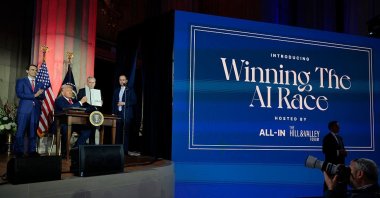 U.S. President Donald Trump displays a signed executive order during the "Winning the AI Race" summit, Washington, U.S., July 23, 2025. (Getty Images Photo)