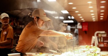 Staff members work in a restaurant, Beijing, China, Aug. 9, 2026. (EPA Photo)