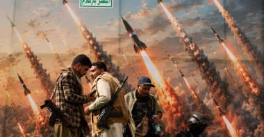 Houthi rebels stand on a platform against a banner depicting Houthi missiles in Sanaa, Yemen, July 31, 2026. (Reuters Photo)