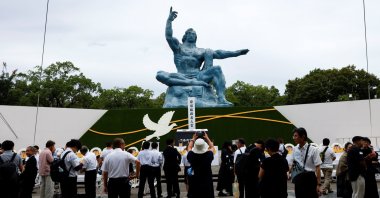 Attendees gather in front of the Nagasaki Peace Statue on the day of a ceremony commemorating the 81st anniversary of the bombing of Nagasaki, southwestern Japan, Aug. 9, 2026. (Reuters Photo)