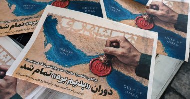 Iranian daily newspaper Hamshahri, featuring a picture of the Strait of Hormuz and a headline quoting Iranian Foreign Minister Abbas Araghchi: 'The Oman deal doesn’t mean the reopening of the Strait of Hormuz,' is seen outside a kiosk in central Tehran, Iran, Aug. 9, 2026. (EPA Photo)