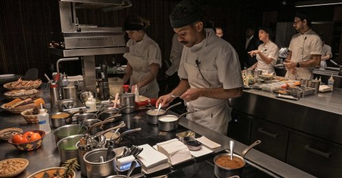 Cooks work in the kitchen of the TUJU restaurant, Sao Paulo, Brazil, July 16, 2026. (AFP Photo)