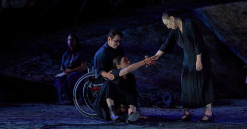 From L-R, Eirini Kourouvani, a wheelchair dancer, Evi Saoulidou and Lydia Fotopoulou perform during a dress rehearsal of Euripides' tragedy "The Trojan Women," staged by the National Theater of Greece, at the Ancient Theater of Epidaurus, Greece, July 30, 2026. (AP Photo)