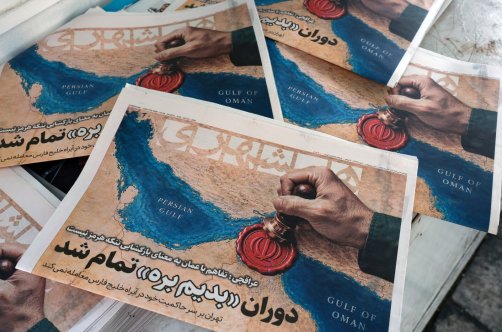 Iranian daily newspaper Hamshahri, featuring a picture of the Strait of Hormuz and a headline quoting Iranian Foreign Minister Abbas Araghchi: 'The Oman deal doesn’t mean the reopening of the Strait of Hormuz,' is seen outside a kiosk in central Tehran, Iran, Aug. 9, 2026. (EPA Photo)
