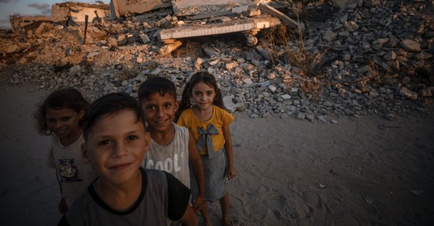 Displaced Palestinian children pose for a photograph among the rubble of destroyed buildings, in Jabalya, north of Gaza City, Palestine, Aug. 7, 2026. (EPA Photo)