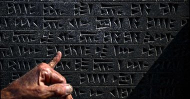 A close-up view of a tablet engraved with Urartu language at the fortress of Çavuştepe near Van, Türkiye, July 22, 2026. (AFP Photo)