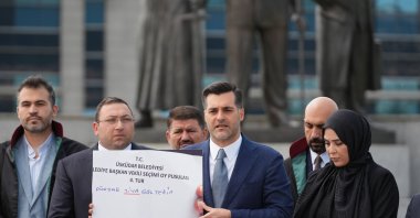 AK Party's Üsküdar Chair Taha Sarıcaoğlu shows an illustration of a vote deemed invalid, outside a courthouse, Istanbul, Türkiye, Aug. 10, 2026. (DHA Photo)