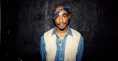 Rapper Tupac Shakur poses for photos backstage after his performance at the Regal Theater, Chicago, U.S., March 1994. (Getty Images Photo)