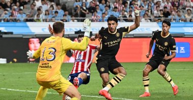 Manchester City’s Omar Marmoush (C) scores his first goal past Atletico Madrid’s keeper Jan Oblak (L) during their preseason friendly in Seoul, South Korea, Aug. 9, 2026. (AFP Photo)