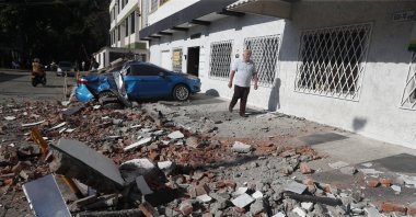 A vehicle damaged by a collapsed wall is seen following an earthquake in Cali, Colombia, Aug. 10, 2026. (EPA Photo)