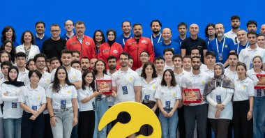 Turkcell CEO Ali Taha Koç (C) and participants of the "5G and Artificial Intelligence for Smart Road Safety Competition" pose for a photo, Istanbul, Türkiye, Aug. 10, 2026. (AA Photo)