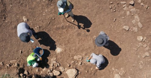 Chinese archaeologists work at the excavation site of Yoğunburç as part of the "Stone Hills Project," uncovering traces dating to the Neolithic Period, Şanlıurfa, Türkiye, Aug. 9, 2026. (AA Photo)