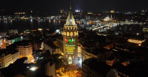 Photos of the agreement signing and the flags of the three countries projected onto Galata Tower, Istanbul, Türkiye, Aug. 9, 2026. (AA Photo)