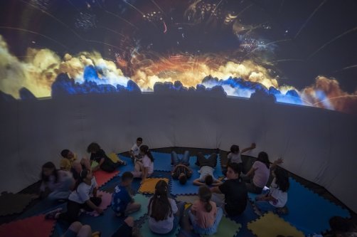 Students explore planets and outer space through immersive visuals during a summer activity, Erzurum, Türkiye, July 21, 2026. (AA Photo)