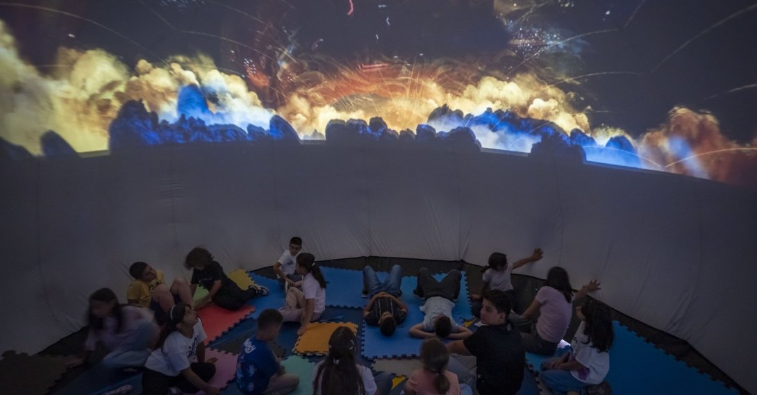 Students explore planets and outer space through immersive visuals during a summer activity, Erzurum, Türkiye, July 21, 2026. (AA Photo)