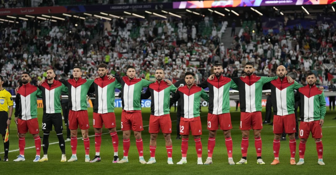 Palestine team players stand for the national anthem ahead of the Asian Cup Group C match between Iran and Palestine at the Education City Stadium, Al Rayyan, Qatar, Jan. 14, 2024. (AP File Photo)