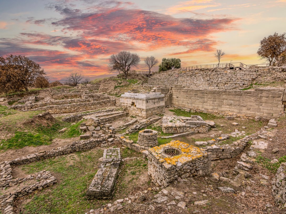 The sanctuary walls and wells of the Troy archeological site, Çanakkale, Türkiye. (Shutterstock Photo)