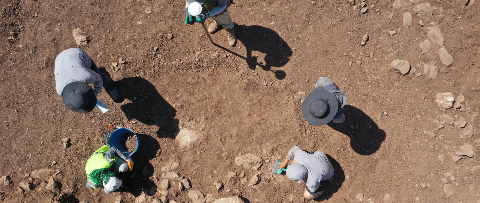 Chinese archaeologists work at the excavation site of Yoğunburç as part of the "Stone Hills Project," uncovering traces dating to the Neolithic Period, Şanlıurfa, Türkiye, Aug. 9, 2026. (AA Photo)