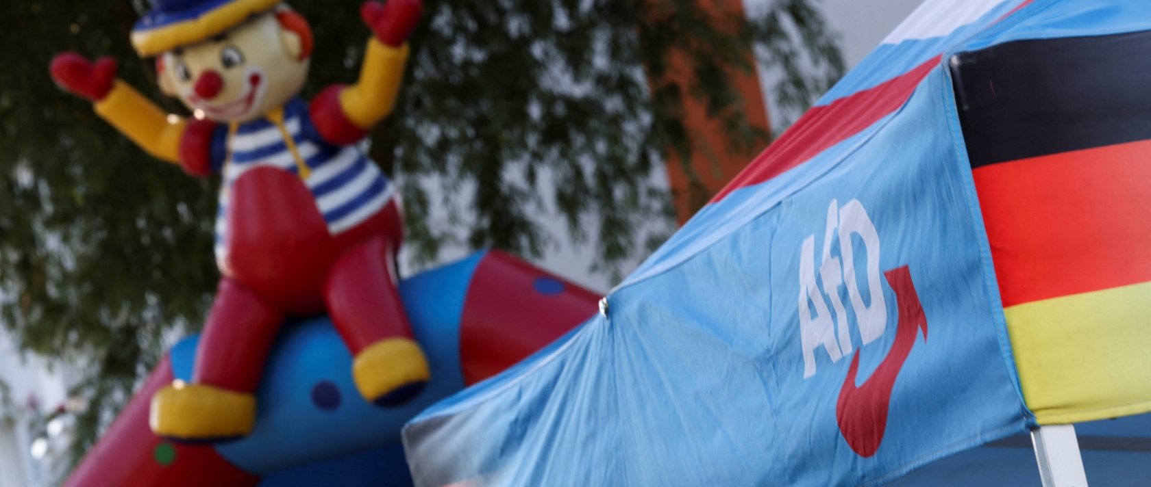 A logo of the Alternative for Germany (AfD) party at a stall during the party's campaign kick-off event ahead of the Mecklenburg-Western Pomerania state election, in Stralsund, Germany, Aug. 8, 2026. (Reuters Photo)