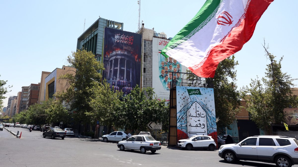 Iranians drive past an anti-U.S.billboard, Tehran, Iran, July 16, 2026. (EPA Photo)