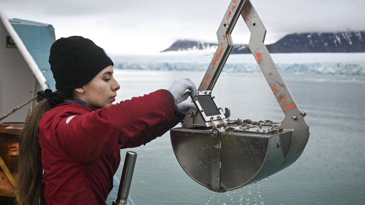 A Turkish scientist examines samples collected from the depths of the Arctic during an expedition in Svalbard, Norway, Aug. 11, 2026. (AA Photo)