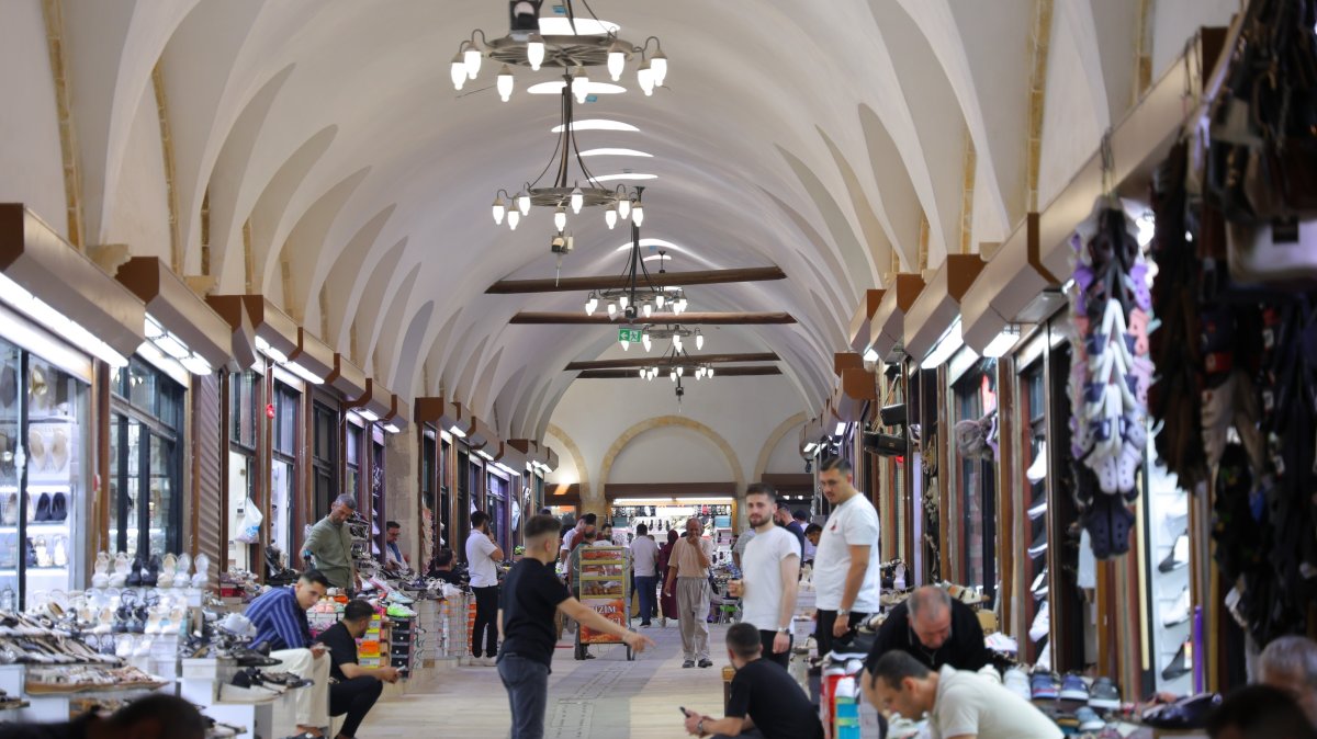 Vendors and passerby are seen in a historic bazaar, Kahramanmaraş, southern Türkiye, July 20, 2026. (IHA Photo)