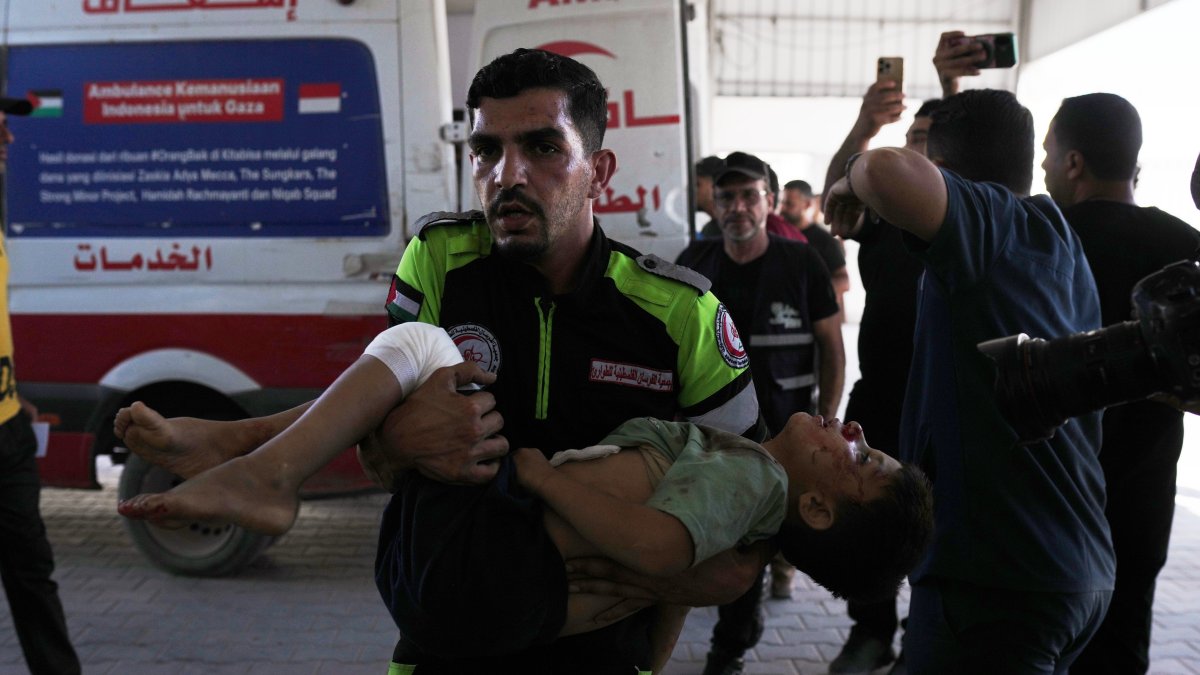 The body of Palestinian child Mousa Al-Habeel, who was killed along with his father in an Israeli airstrike, is brought to Shifa Hospital in Gaza City, Palestine, June 15, 2026. (AP Photo)