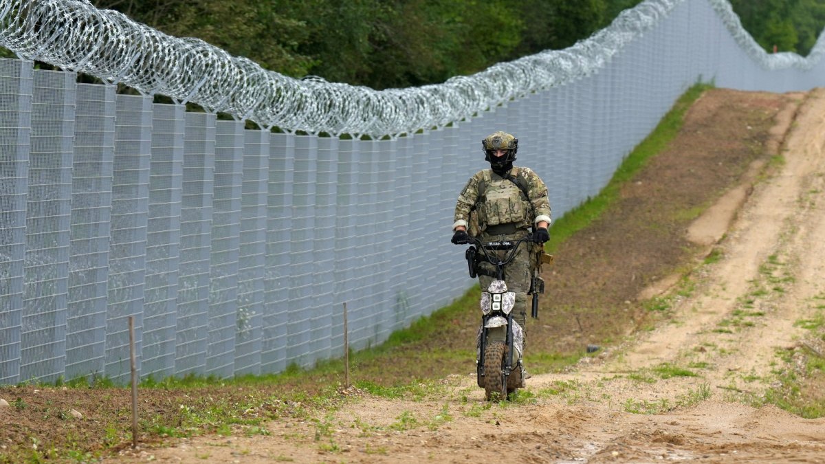 Latvian special unit Border Guard officer patrols along the fence at the Latvia-Belarus border near Robeznieki, Latvia Aug. 8, 2023. (Reuters File Photo)