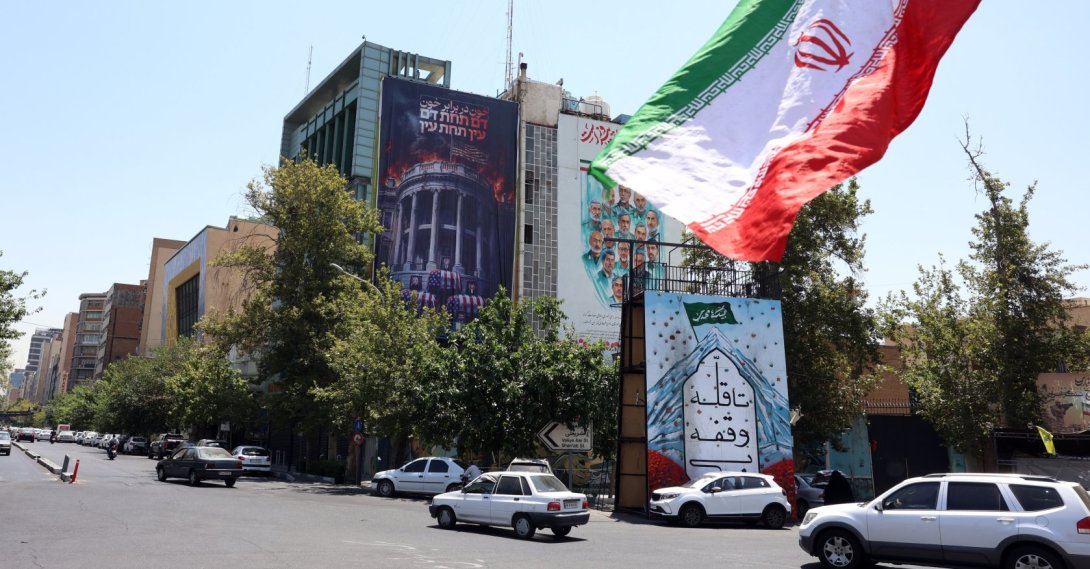 Iranians drive past an anti-U.S.billboard, Tehran, Iran, July 16, 2026. (EPA Photo)
