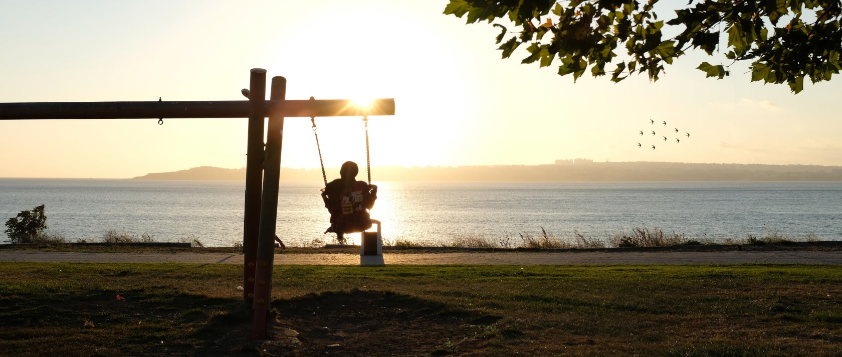 A girl swings on a swing at sunset at a park, Beylikdüzü, Istanbul, Türkiye, July 24, 2020. (Getty Images Photo)