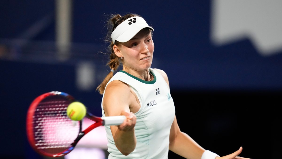 Kazakhstan's Elena Rybakina hits a return to Japan's Naomi Osaka during a National Bank Open tennis match, Toronto, Canada, Aug. 11, 2026. (AP Photo)
