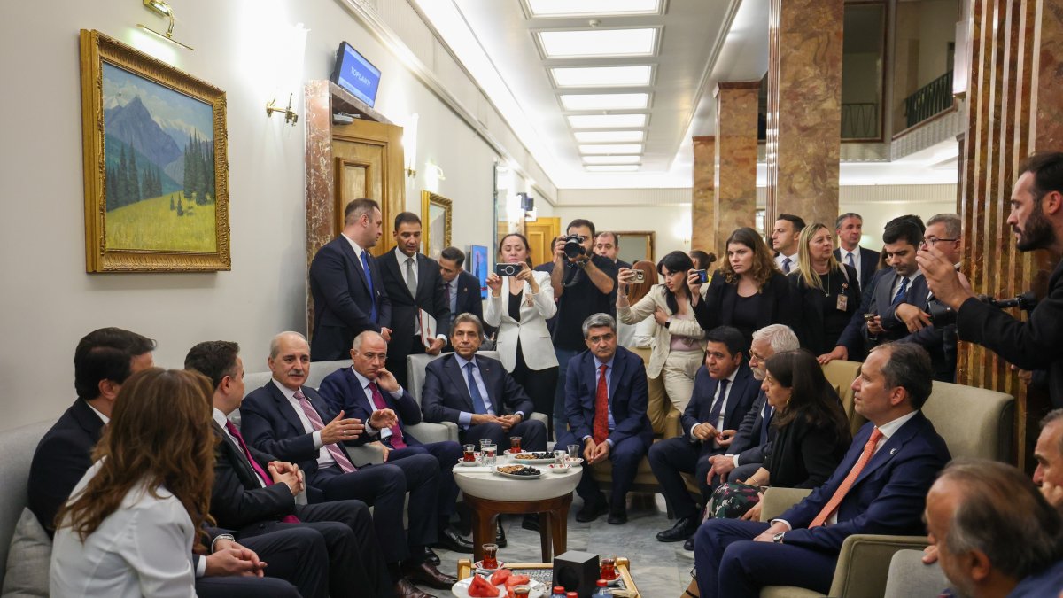 Parliament Speaker Numan Kurtulmuş chats with representatives of political parties after the parliament passed a law, Ankara, Türkiye, Aug. 11, 2026. (AA Photo)