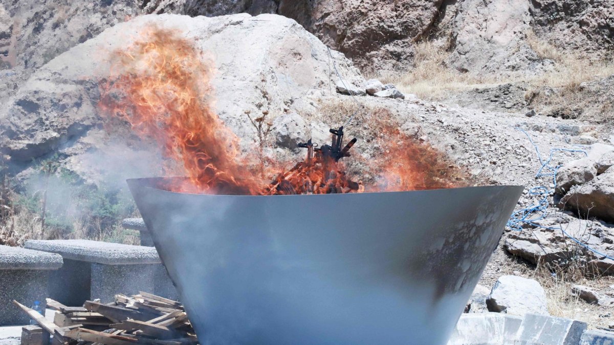 The PKK terrorist group's weapons are burned during a ceremony, Sulaimaniyah, Iraq, July 11, 2025. (AFP Photo)