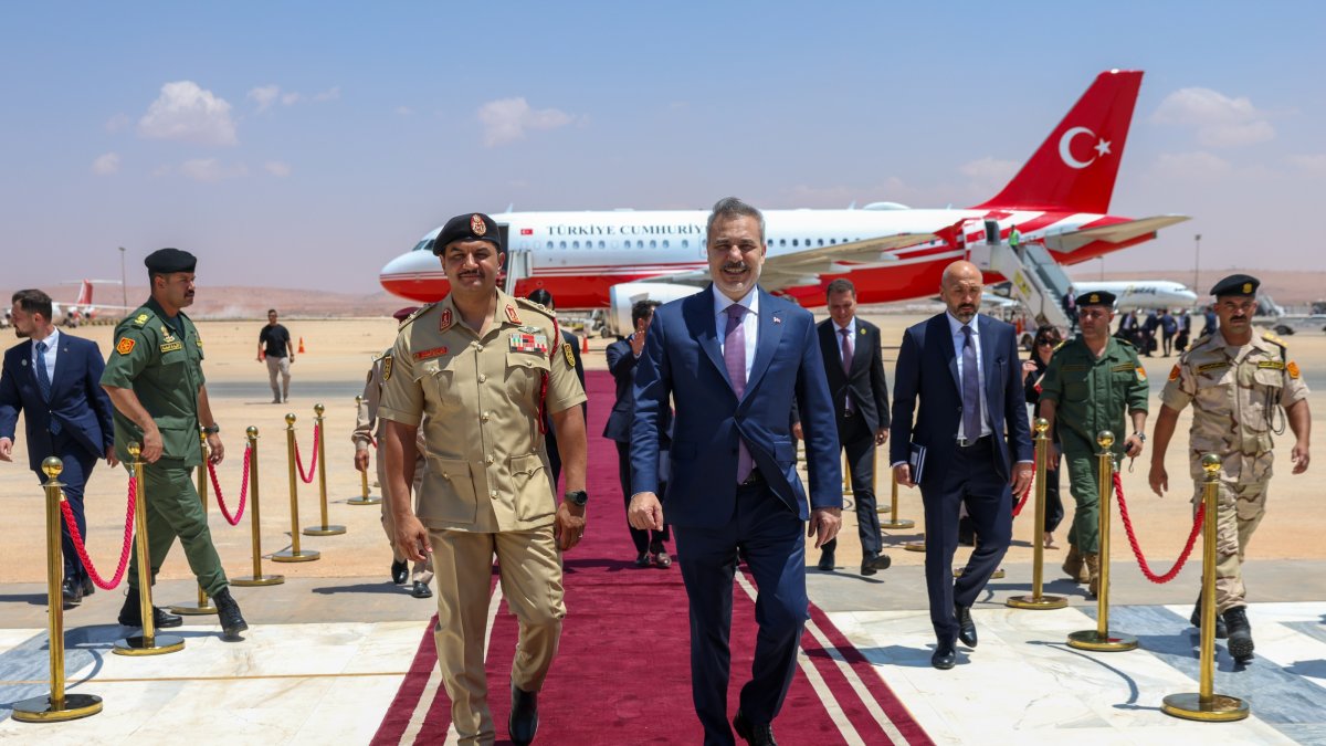 Saddam Haftar (L) and Foreign Minister Hakan Fidan walk on the red carpet at the welcoming ceremony for Fidan, Benghazi, Libya, Aug. 12, 2026. (AA Photo)