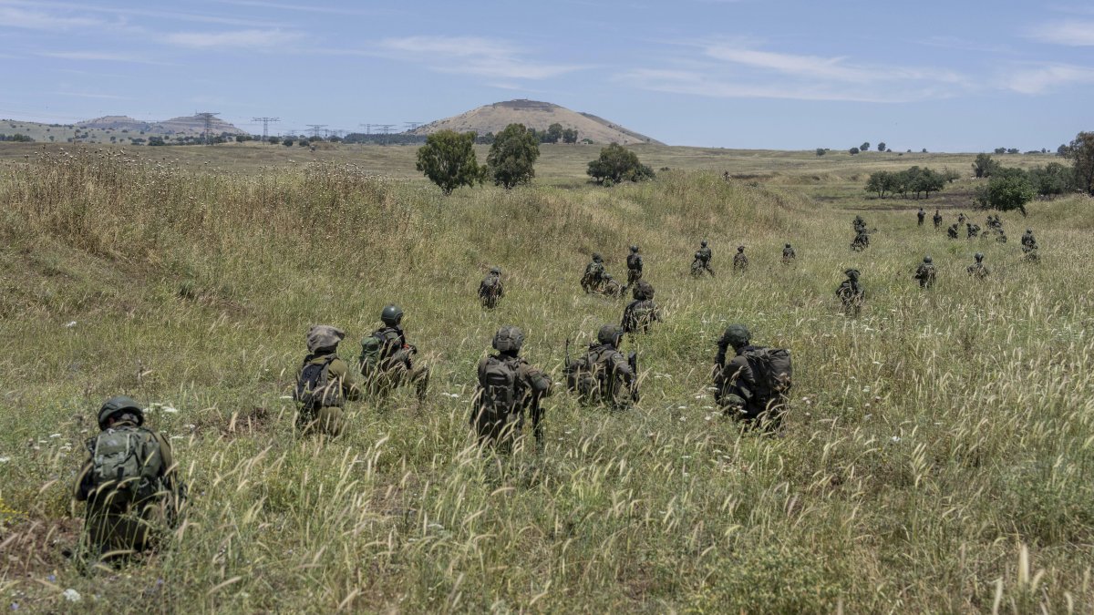 Israeli troops take position during training in the Israeli-occupied Golan Heights, Syria, May 8, 2024. (AP Photo)