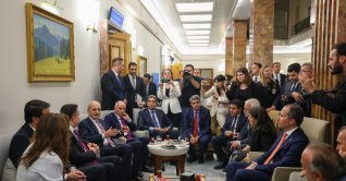 Parliament Speaker Numan Kurtulmuş chats with representatives of political parties after the parliament passed a law, Ankara, Türkiye, Aug. 11, 2026. (AA Photo)