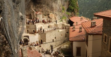Visitors explore the Sümela Monastery, a historic rock-cut monastery built into the cliffs of the Altındere Valley, Trabzon, northeastern Türkiye, July 29, 2026. (Photo by Buğra Çakmak)