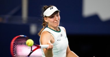 Kazakhstan's Elena Rybakina hits a return to Japan's Naomi Osaka during a National Bank Open tennis match, Toronto, Canada, Aug. 11, 2026. (AP Photo)