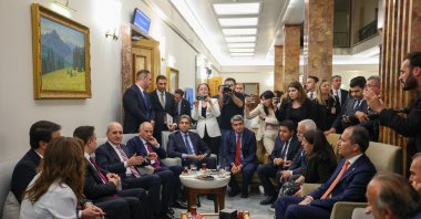 Parliament Speaker Numan Kurtulmuş chats with representatives of political parties after the parliament passed a law, Ankara, Türkiye, Aug. 11, 2026. (AA Photo)