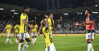 Fenerbahçe's Talisca (C) celebrates a goal during the UEFA Champions League third qualifying round match against Sturm Graz at Liebenau Stadium, Styria, Austria, Aug. 11, 2026. (AA Photo)