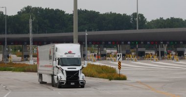 The first commercial truck, hauling auto parts, crosses the Gordie Howe International Bridge that connects Windsor, Ontario, to Detroit, Michigan, U.S., in Windsor, Ontario, Canada, July, 27, 2026. (Reuters Photo)