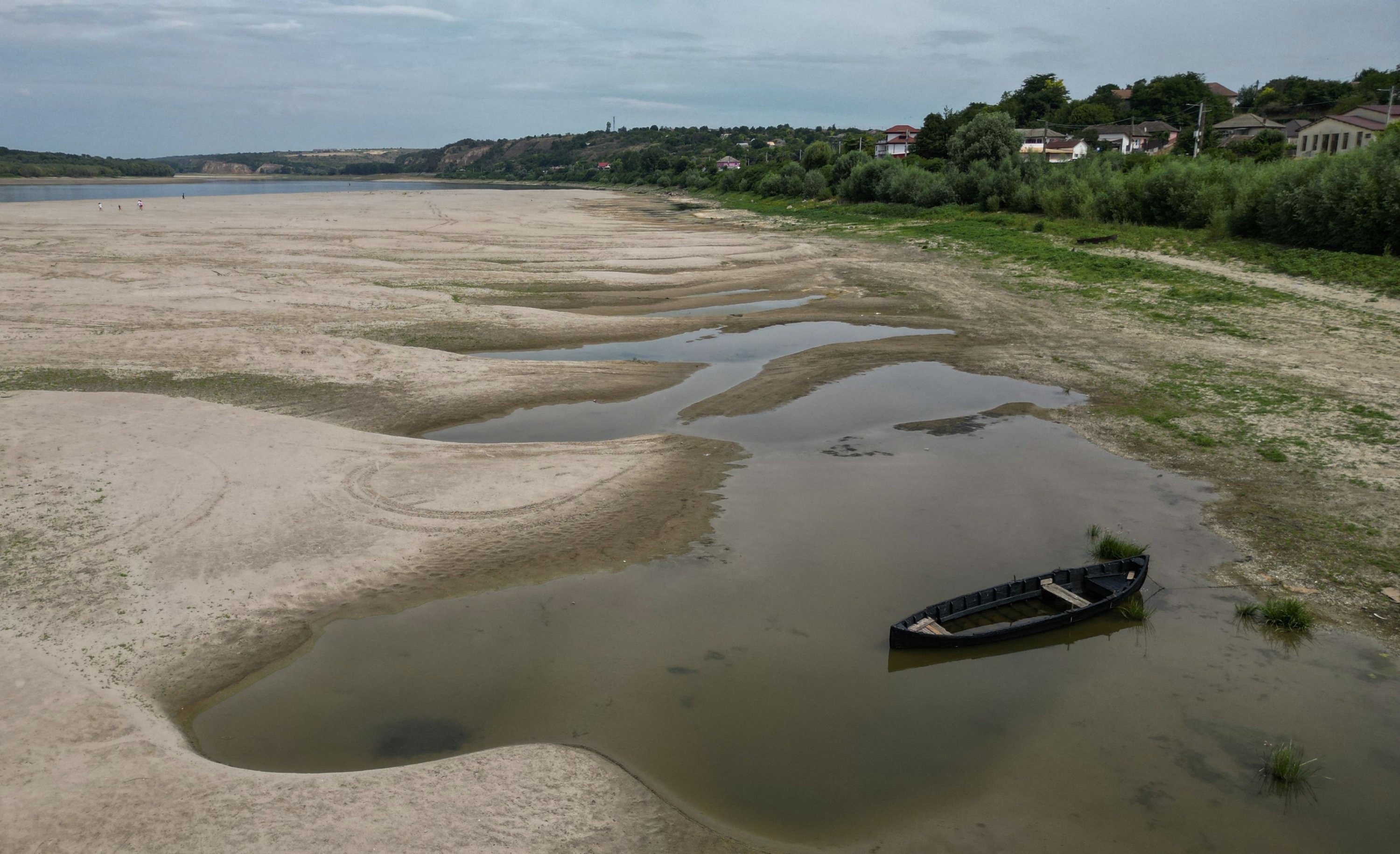 An aerial view shows a dried-out river bed of the Danube in Rasova village, Romania, Aug. 3, 2026. (AFP Photo)
