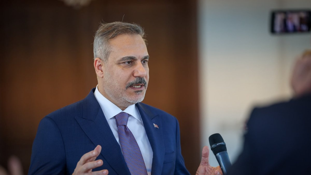 Foreign Minister Hakan Fidan speaks to reporters before departing following a series of meetings, Benghazi, Libya, Aug. 12, 2026. (DHA Photo)